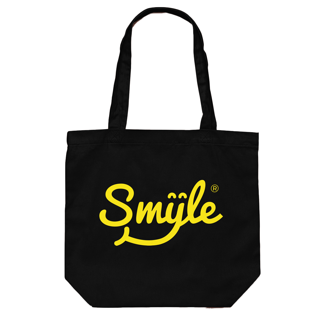 a black tote bag with the word Smyle™ printed on it