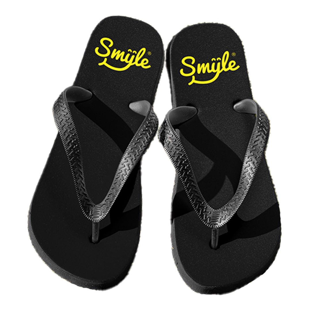a pair of black sandals with a Smyle™ on them